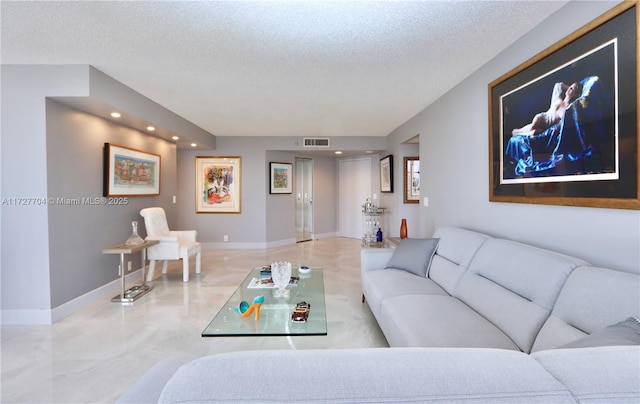 living room featuring a textured ceiling