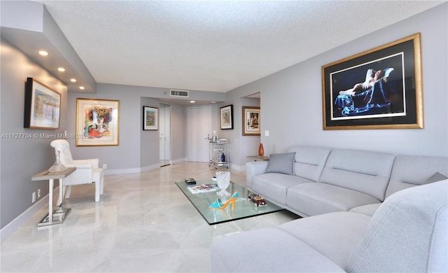 living room with a textured ceiling