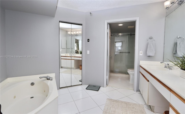 full bathroom featuring toilet, independent shower and bath, tile patterned floors, a textured ceiling, and vanity