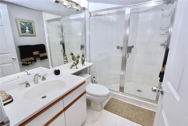 bathroom featuring an enclosed shower, vanity, tile patterned flooring, and toilet