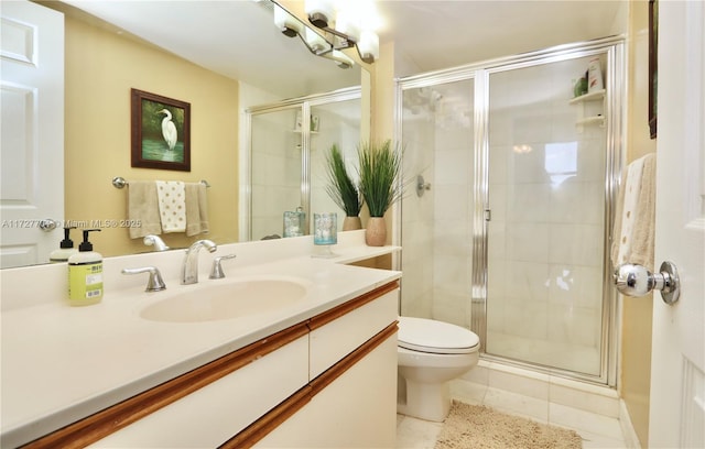 bathroom with toilet, tile patterned floors, vanity, and an enclosed shower