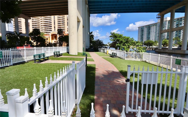 view of property's community with a yard