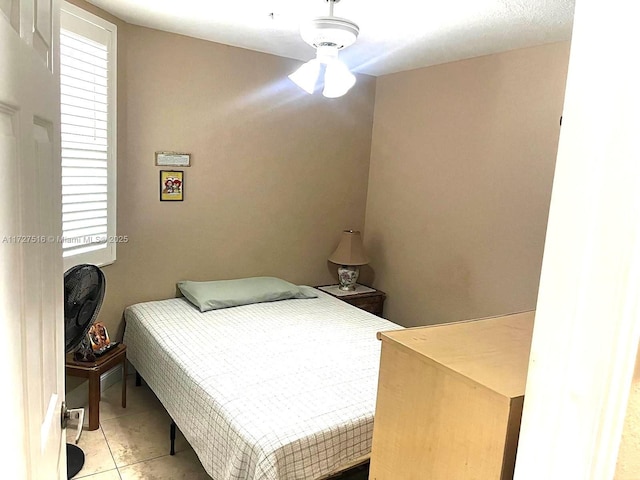 bedroom featuring light tile patterned floors