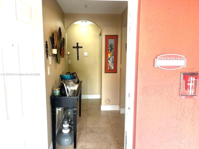 hallway with light tile patterned floors