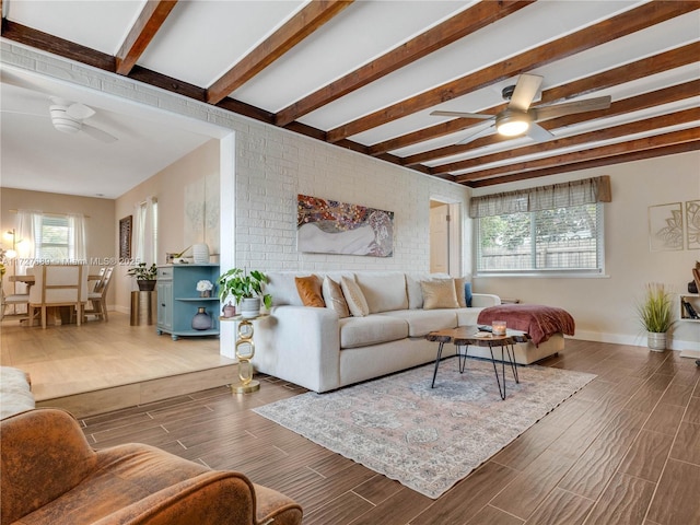 living room with beamed ceiling and ceiling fan