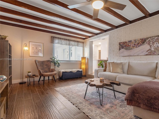 living room featuring beamed ceiling, ceiling fan, and dark hardwood / wood-style flooring