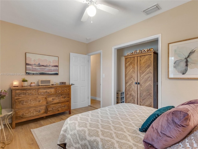 bedroom with ceiling fan and light wood-type flooring