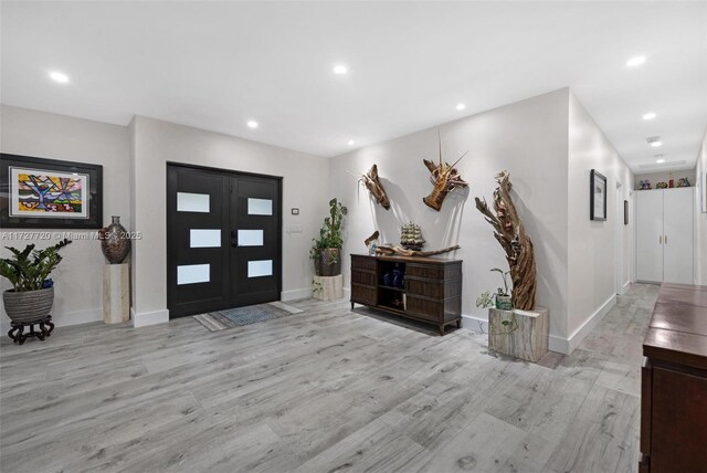 entrance foyer with light wood-type flooring