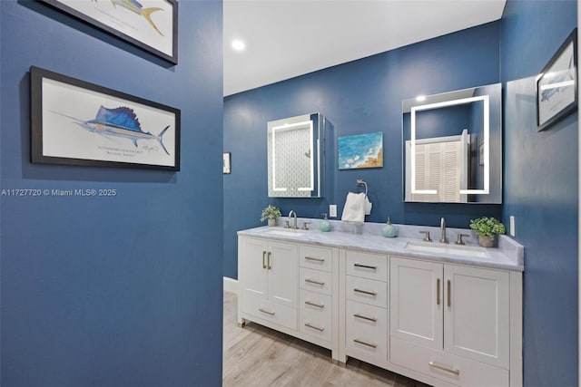 bathroom with hardwood / wood-style flooring and vanity