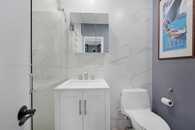 bathroom featuring vanity, toilet, and an enclosed shower