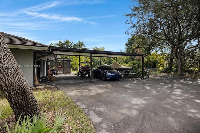 view of parking featuring a carport