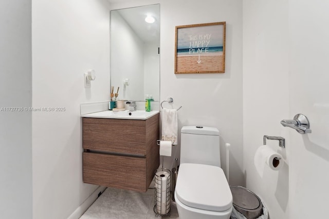 bathroom with toilet and vanity