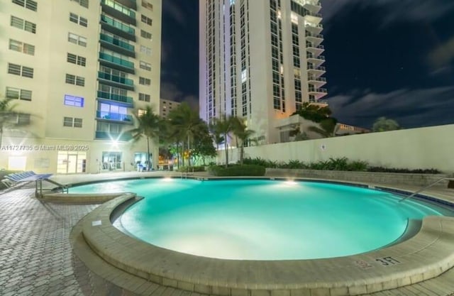 view of swimming pool with a patio