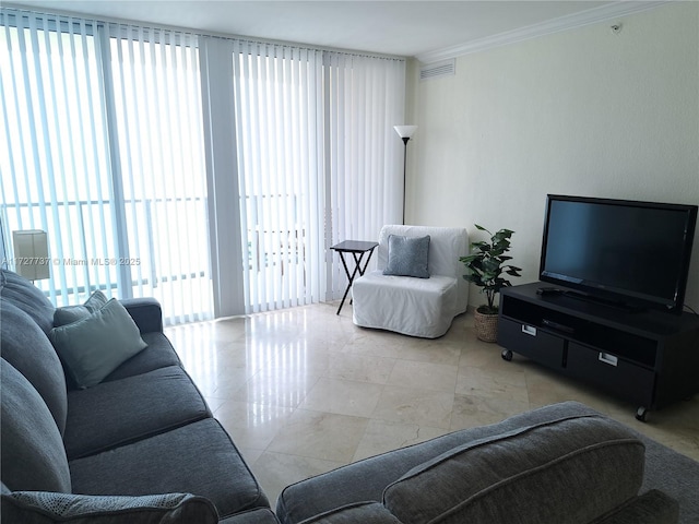 living room featuring crown molding