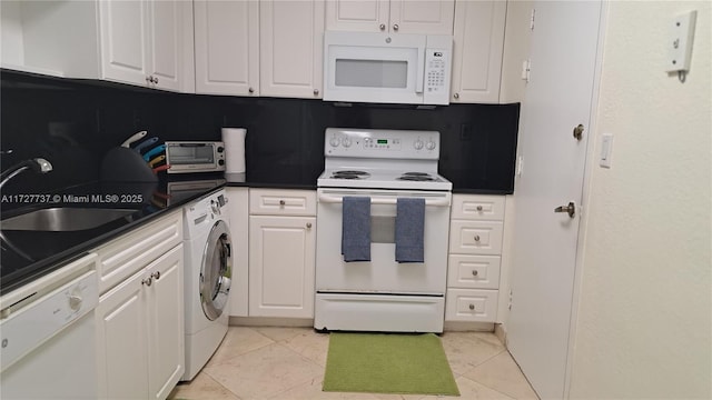 kitchen with washer / clothes dryer, sink, light tile patterned floors, white appliances, and white cabinets