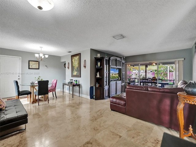 580 Eastwood Ln, Weston, FL 33326 - living room with a chandelier, a textured ceiling, baseboards, and visible vents
