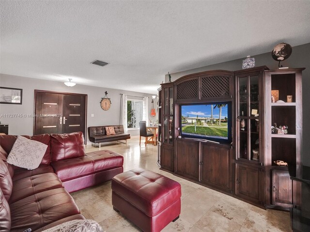 580 Eastwood Ln, Weston, FL 33326 - living room with visible vents and a textured ceiling