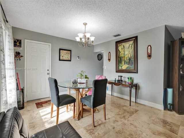 580 Eastwood Ln, Weston, FL 33326 - dining area with baseboards, a chandelier, visible vents, and a textured ceiling