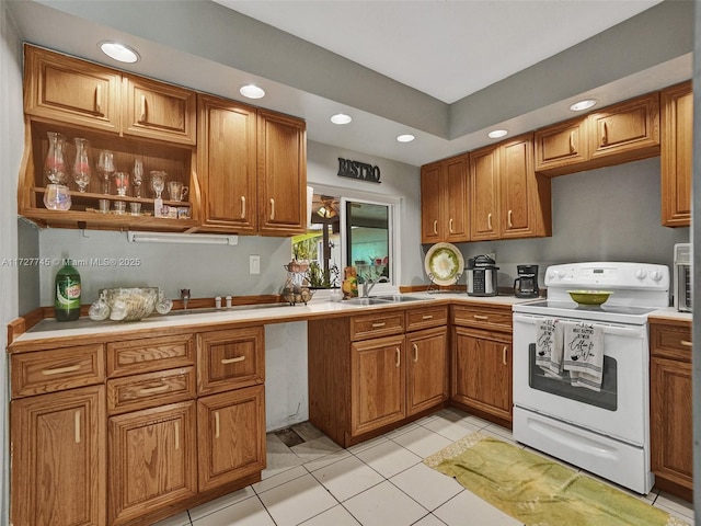 580 Eastwood Ln, Weston, FL 33326 - kitchen with brown cabinets, white electric stove, recessed lighting, and a sink