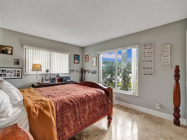 580 Eastwood Ln, Weston, FL 33326 - bedroom with baseboards and a textured ceiling
