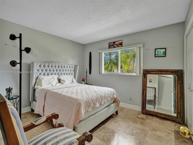 580 Eastwood Ln, Weston, FL 33326 - bedroom featuring baseboards and a textured ceiling