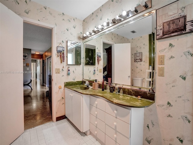 580 Eastwood Ln, Weston, FL 33326 - bathroom featuring visible vents, vanity, tile patterned floors, and wallpapered walls