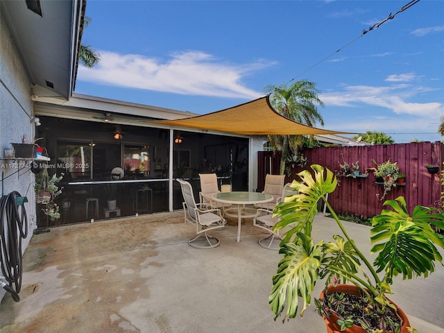 580 Eastwood Ln, Weston, FL 33326 - view of patio featuring fence, a sunroom, and outdoor dining area