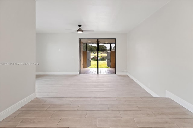 empty room featuring light wood-type flooring and ceiling fan