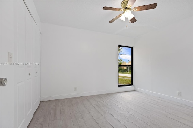 unfurnished room with ceiling fan and light hardwood / wood-style floors