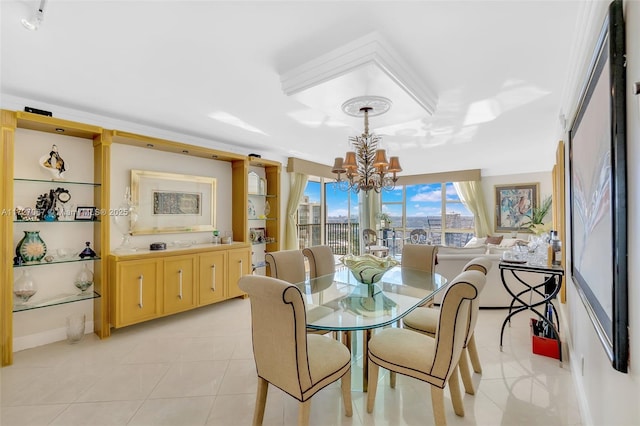 dining area featuring a notable chandelier and light tile patterned floors