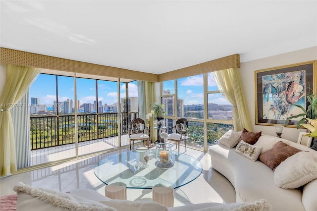 living room with tile patterned flooring and a wall of windows