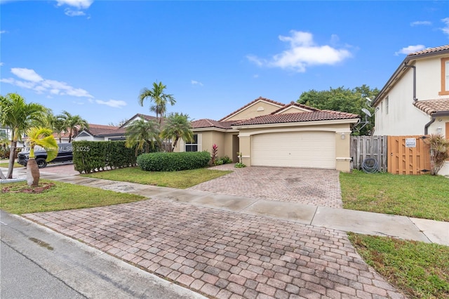 view of front facade featuring a front yard and a garage