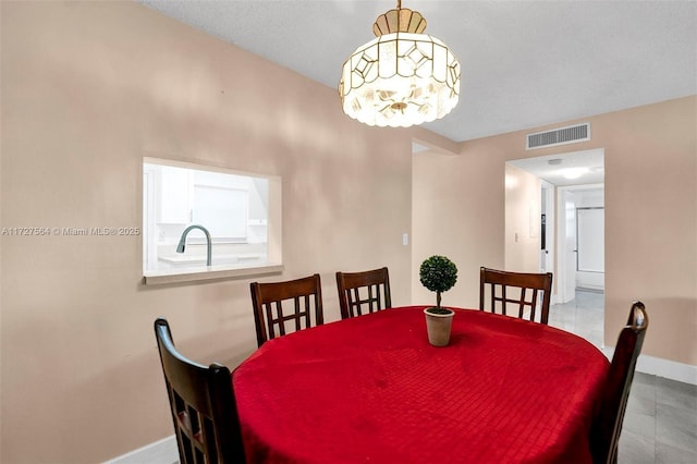 dining area featuring light tile patterned floors