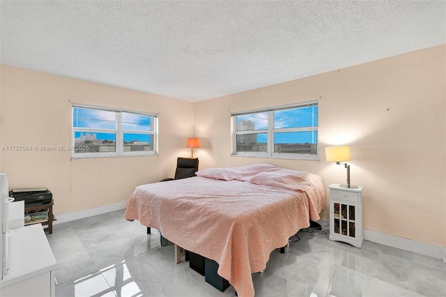 bedroom featuring a textured ceiling