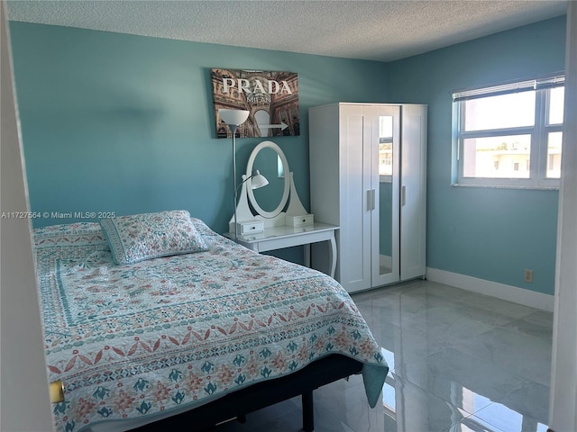 bedroom featuring a textured ceiling