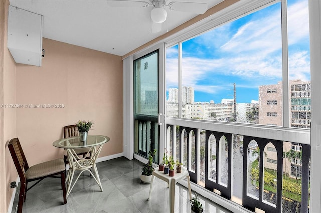 balcony featuring ceiling fan