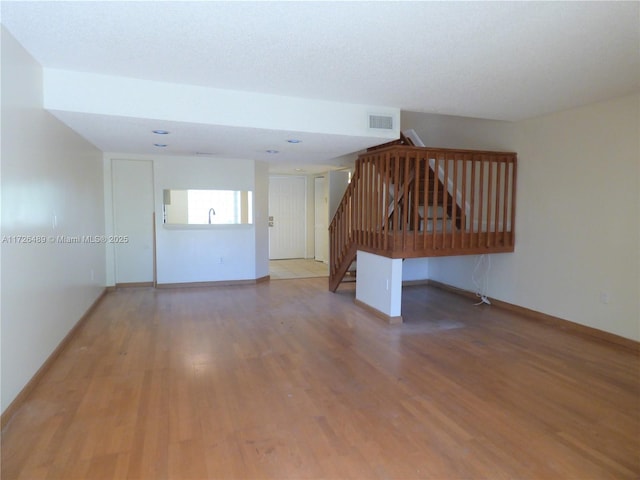 unfurnished room with light hardwood / wood-style flooring