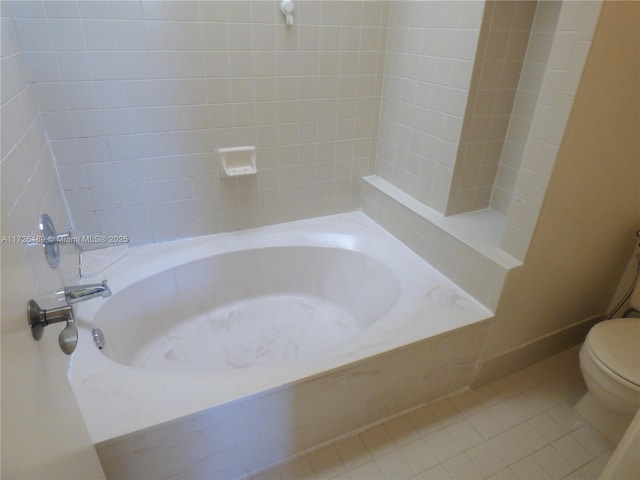 bathroom featuring toilet and tile patterned flooring