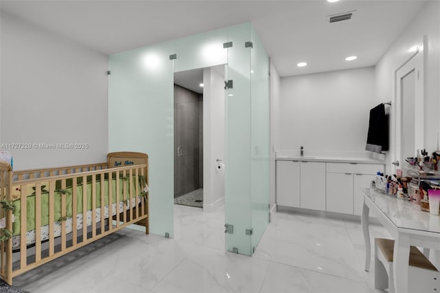 interior space featuring walk in shower and vanity