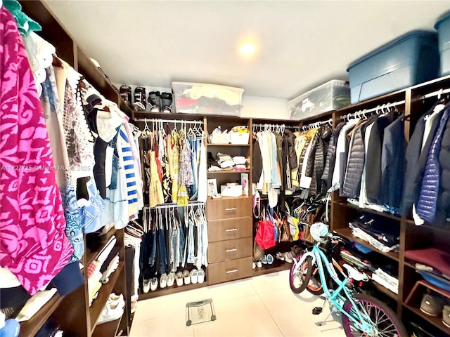 spacious closet featuring tile patterned flooring