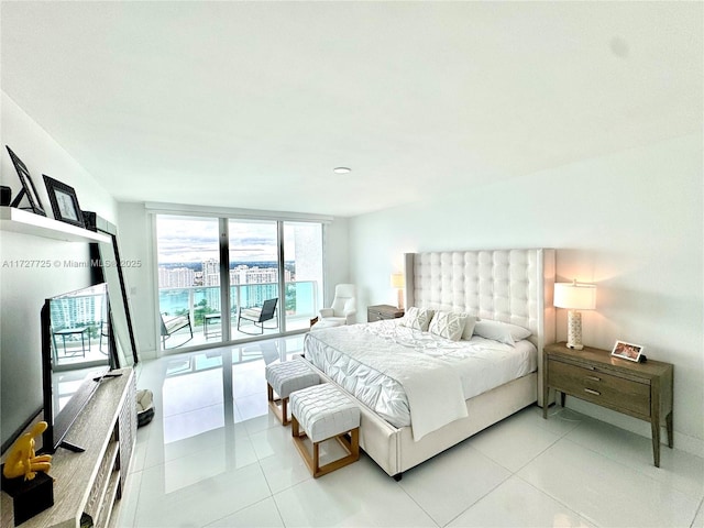 tiled bedroom featuring expansive windows and access to exterior