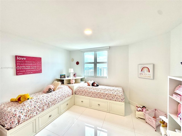 bedroom with light tile patterned floors