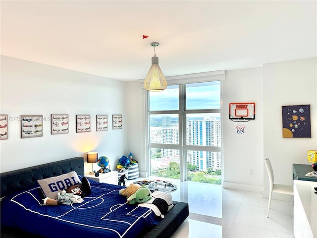 bedroom with floor to ceiling windows and tile patterned floors