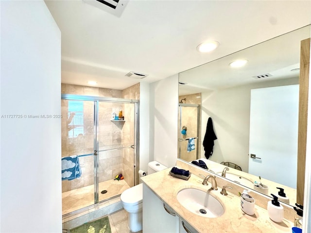 bathroom with vanity, an enclosed shower, tile patterned flooring, and toilet