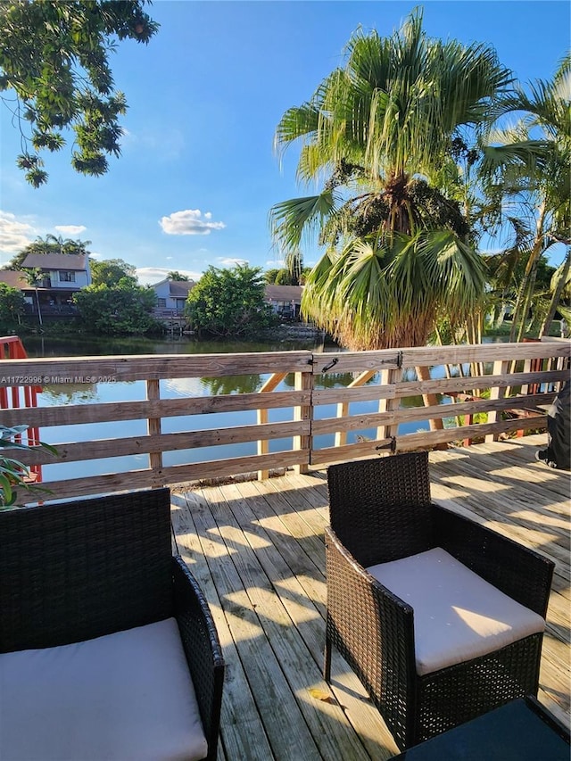 wooden deck with a water view