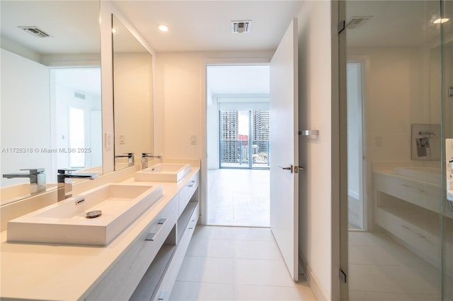 bathroom featuring tile patterned flooring and vanity