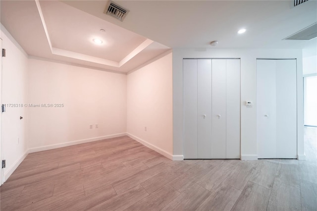 unfurnished bedroom featuring two closets