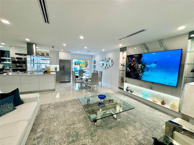 living room featuring a textured ceiling