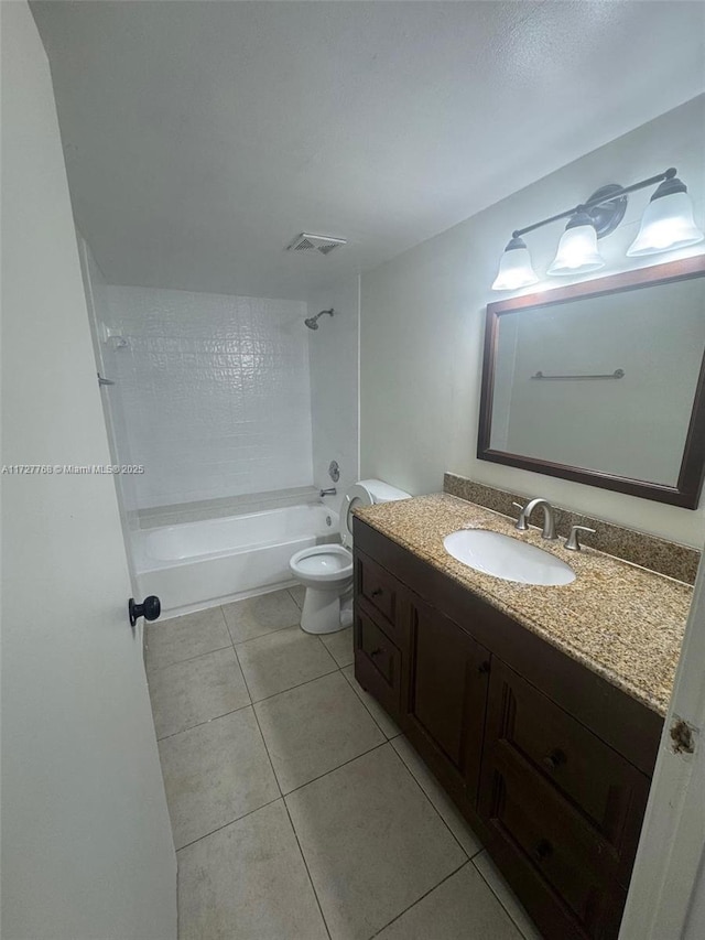 full bathroom with toilet, vanity, tile patterned flooring, and tiled shower / bath