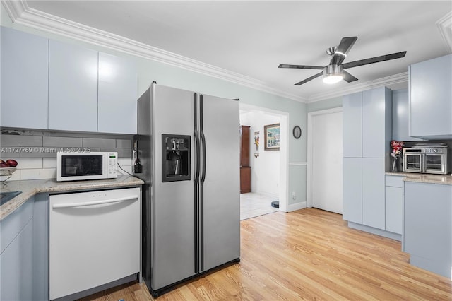 kitchen with ceiling fan, white appliances, ornamental molding, and light wood-type flooring